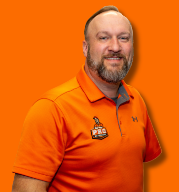 staff photo of exterior specialist brad wazlavek in orange pro exteriors polo