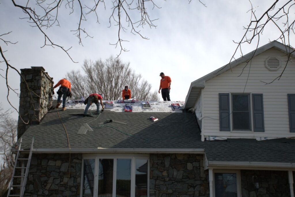 Pro Exteriors team working on a roof replacement