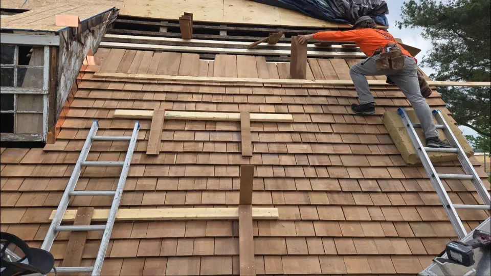 pro exteriors roofer installs cedar perfections shingles