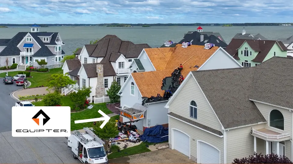 image of the equipter set up at eave of a beach house during a roof tear off by pro exteriors