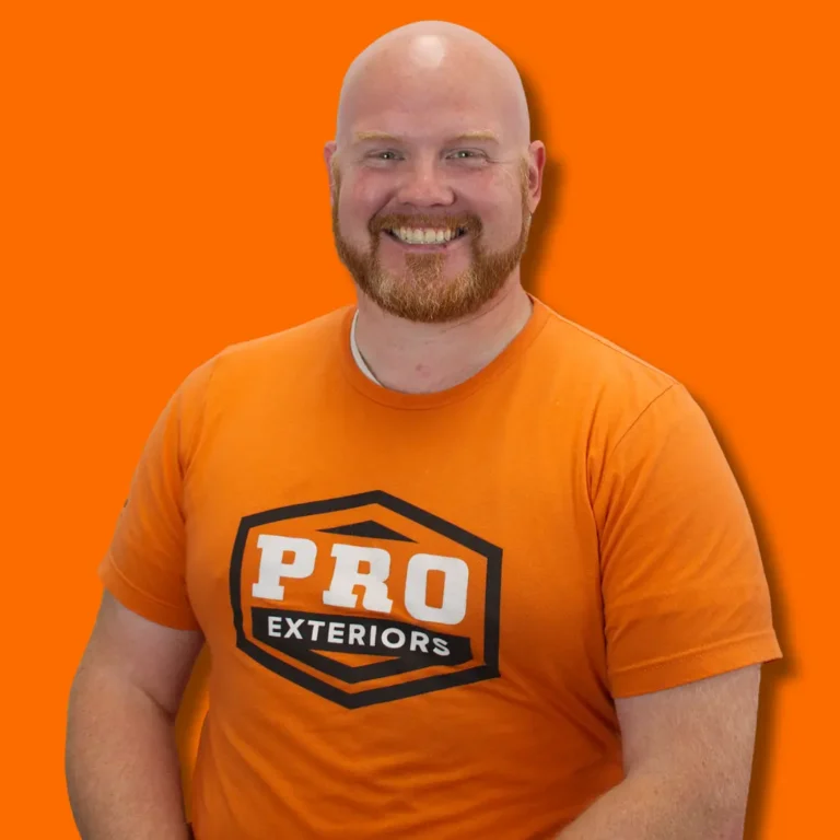 team photo of chris maddox the production coordinator at pro exteriors wearing an orange pro exteriors team t shirt